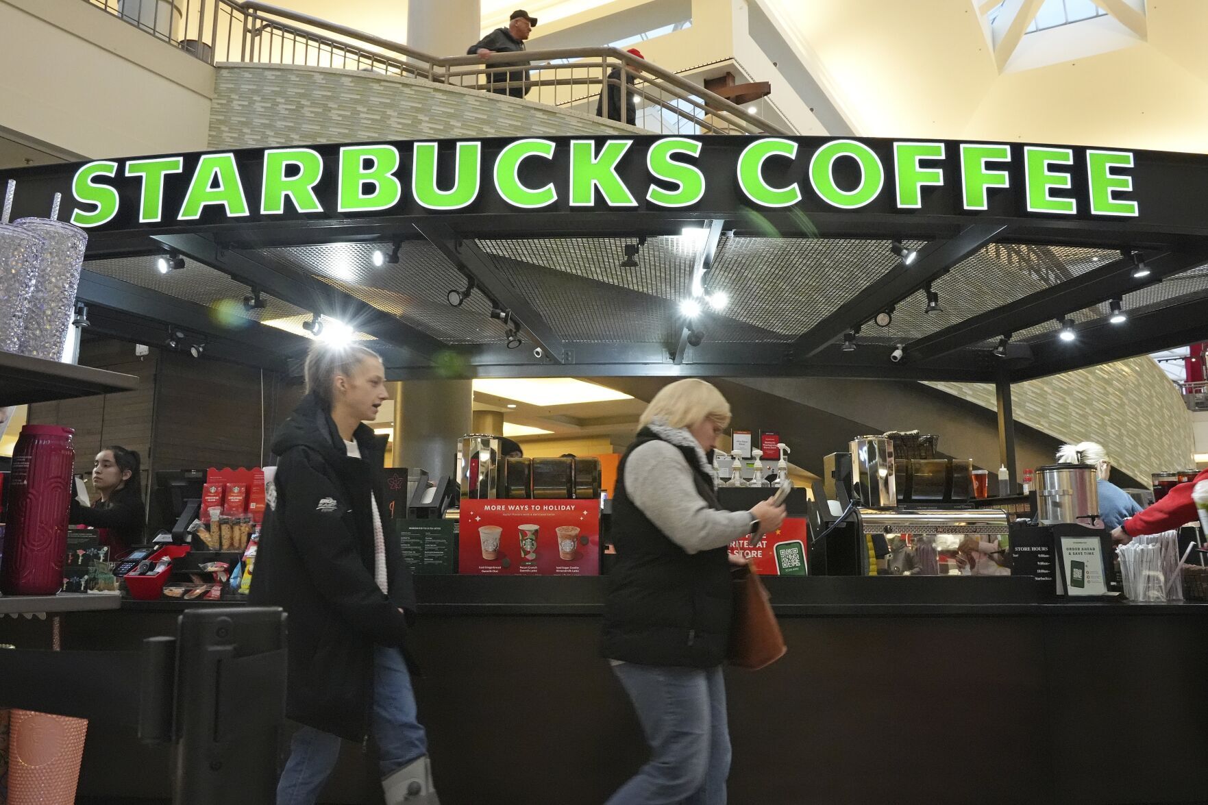Starbucks workers plan strikes that could spread to hundreds of US stores by Christmas Eve