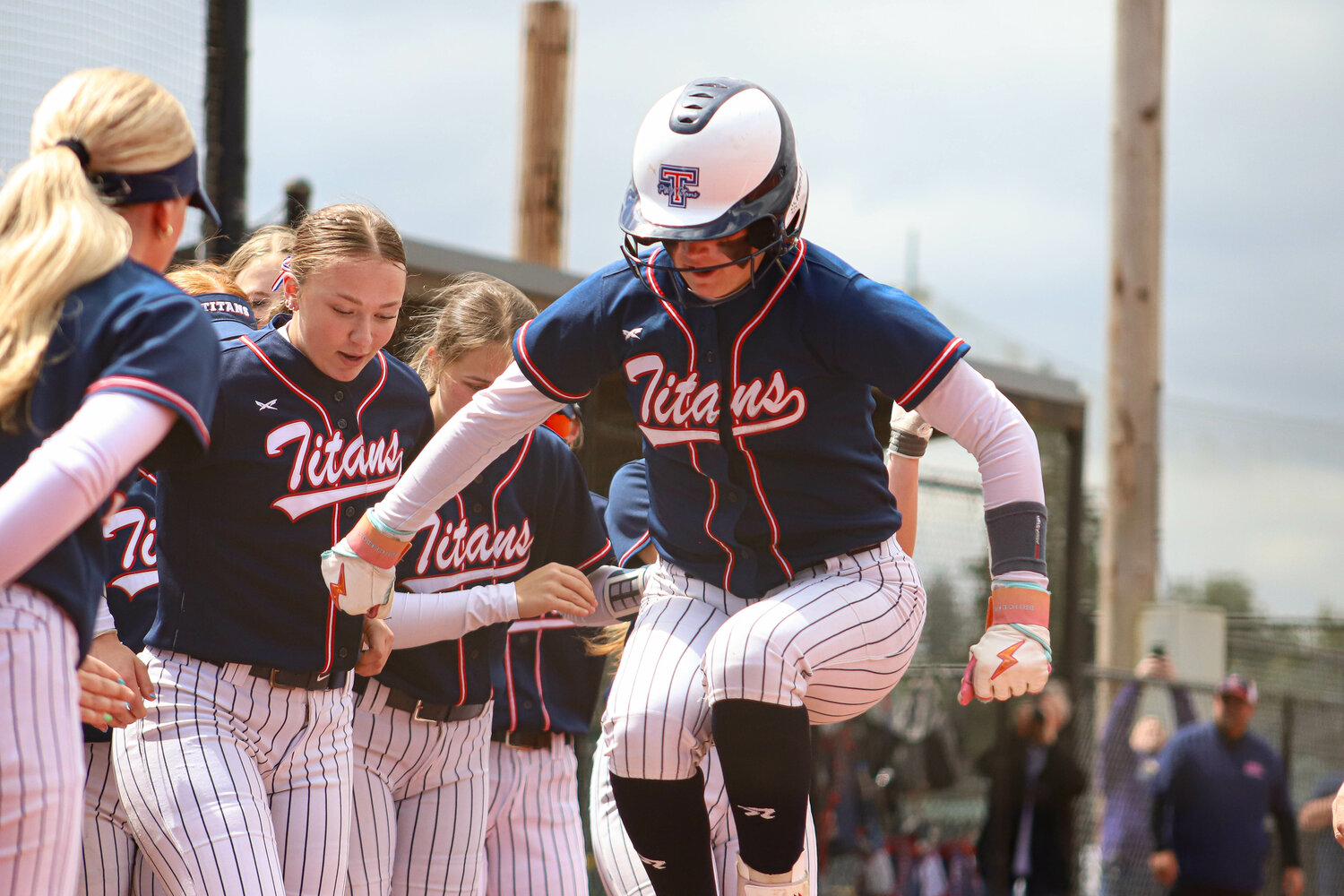 Prep softball: Titans roll to pair of victories, return to district title game