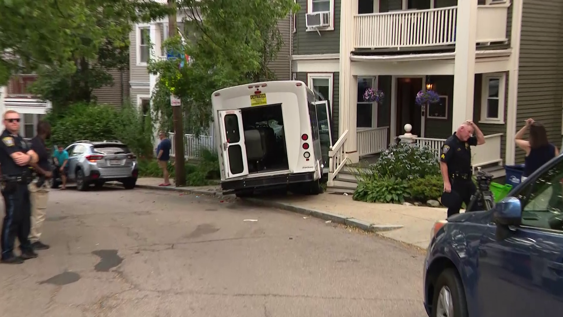 Passenger van crashes into Boston building, sending 14 to hospital