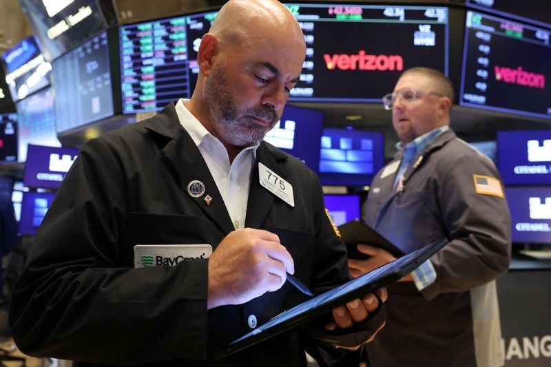 Nasdaq closes lower, weighed by tech stocks, Dow ends sharply higher