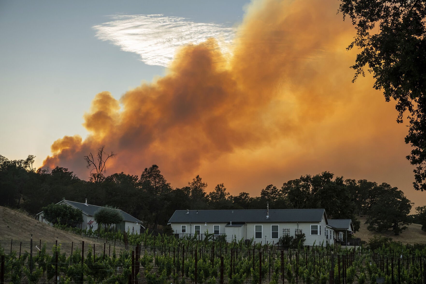 Wildfires expand in Oregon and California, threatening homes and prompting evacuations